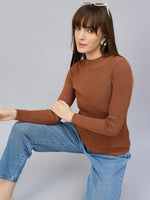 Woman in 98degreenorth Dark Camel Turtle Neck Ribbed Sweater and blue jeans, sunglasses on head.