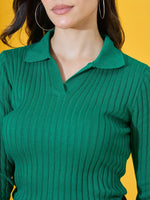 Woman in a 98degreenorth emerald green ribbed collar sweater, styled with hoop earrings on a yellow background.