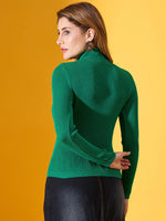 Woman in a 98degreenorth emerald green ribbed slim fit turtle neck sweater, back to camera, against yellow background.