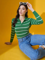 Woman wears 98degreenorth Fern Green Striped Collared Sweater, jeans, holding white sunglasses on yellow background.