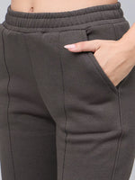 Person wearing 98degreenorth olive flared bootcut fleece sweatpants with high waist and seam details.