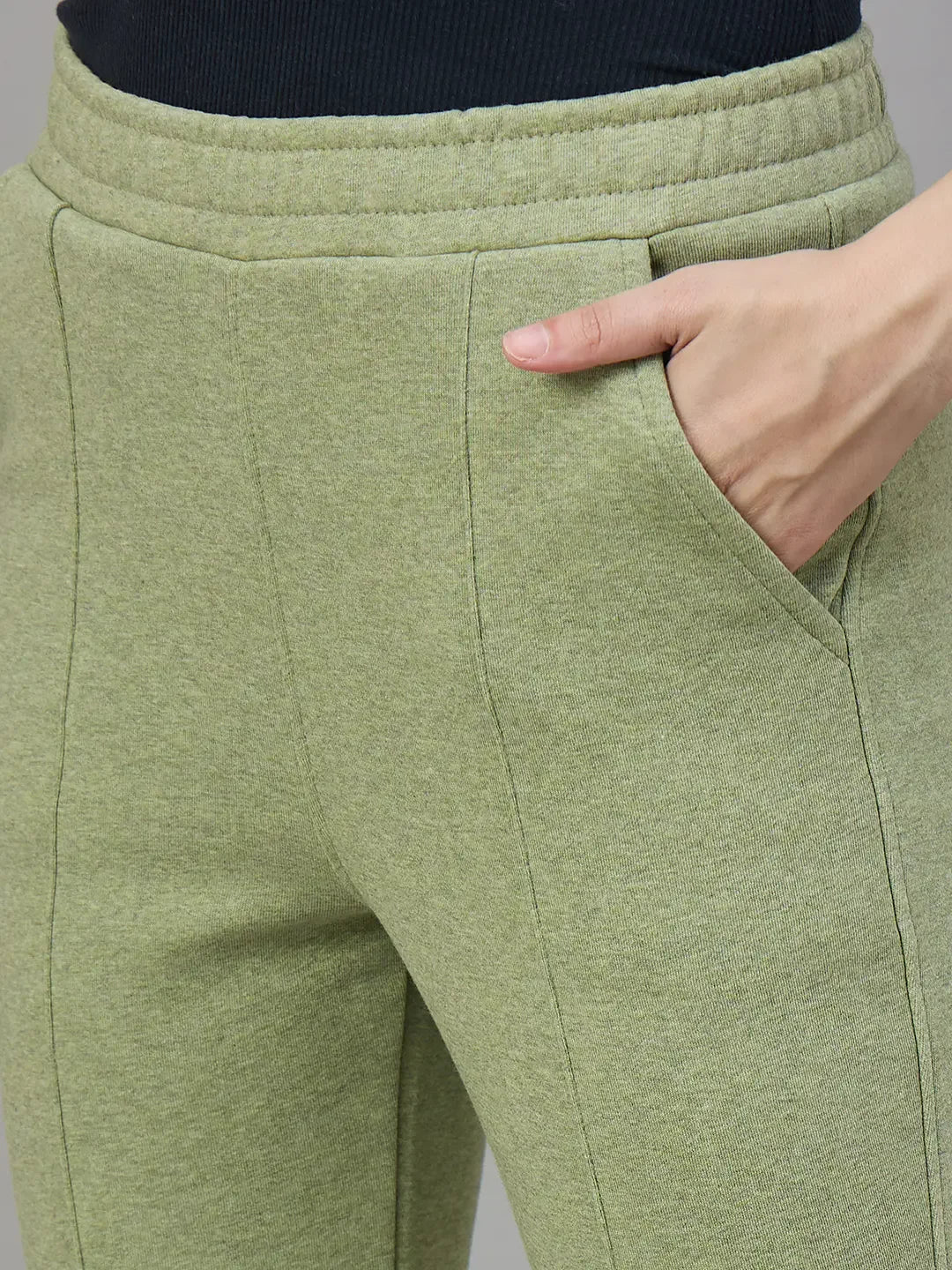 Close-up of 98degreenorth Women’s Flared Bootcut Fleece Sweatpants in Pista Melange, soft cozy streetwear for winter.