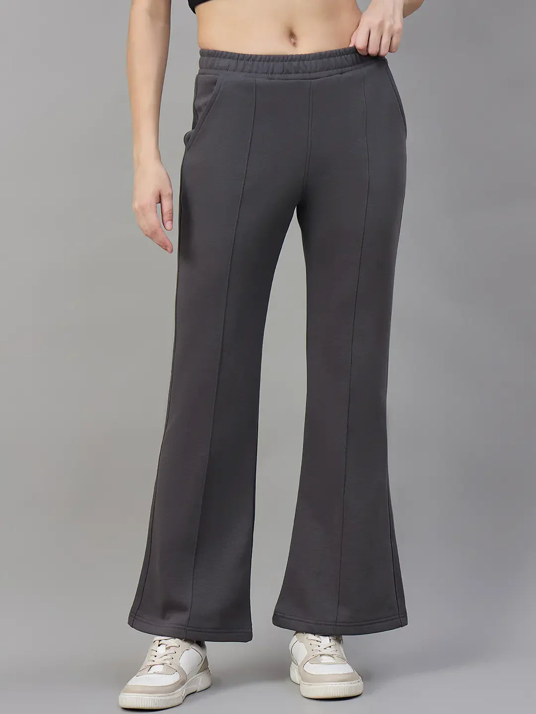 98degreenorth Women’s Flared Sweatpants in Charcoal Grey—warm fleece bootcut pants styled with white sneakers.
