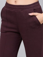 Close-up of 98degreenorth Women’s Flared Sweatpants in Dark Wine, highlighting high waist, waistband, and seam details.