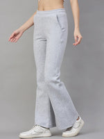 Model wears 98degreenorth Women’s Flared Sweatpants in Light Grey—classic soft fleece loungewear, styled with white sneakers.