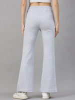 Model wears 98degreenorth Women’s Flared Sweatpants in Light Grey, classic soft fleece winter loungewear with sneakers.
