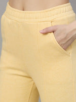 Person wears 98degreenorth Women’s Flared Sweatpants in Mango Melange—a cozy, trendy winter choice for women.