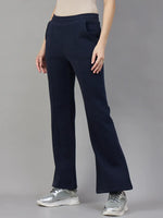 Model wears 98degreenorth Women’s Flared Sweatpants in Navy Melange – Warm Lounge Track Pants against a gray backdrop.