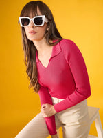 Woman in white sunglasses wears 98degreenorth fuchsia pink ribbed collar sweater against a bright yellow background.