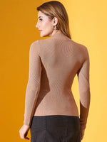 Woman in 98degreenorth’s light camel ribbed high-neck pullover, slim fit knit sweater—stylish winter workwear India.