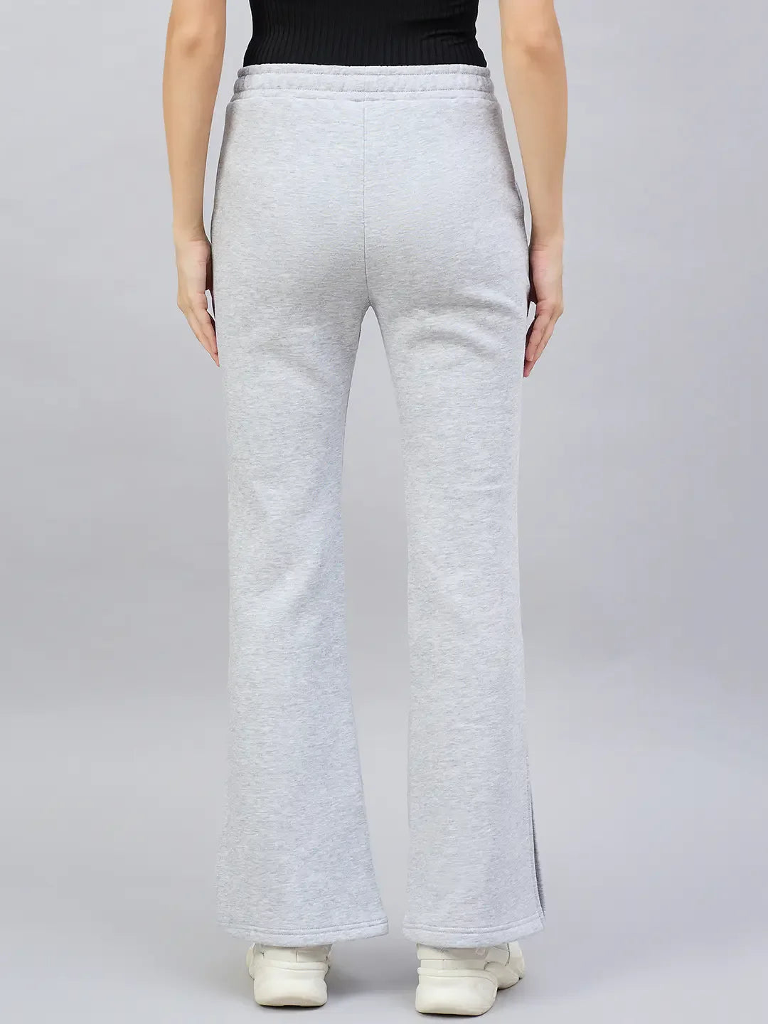 Person wearing 98degreenorth Women’s Light Grey Bootcut Sweatpants, shown from the back against a grey background.