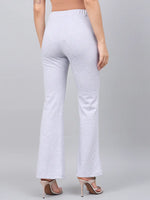 Woman wears 98degreenorth Light Grey Flared Bootcut Stretchable Trousers, seen from the back against a grey background.