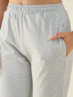 Person wearing 98degreenorth Women’s Light Grey Regular Fit Cotton Stretchable Trousers with an elastic waistband.