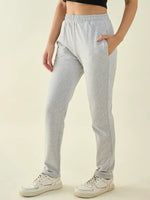 Person wears 98degreenorth Women’s Light Grey Regular Fit Cotton Stretchable Trousers with a black crop top and white sneakers.