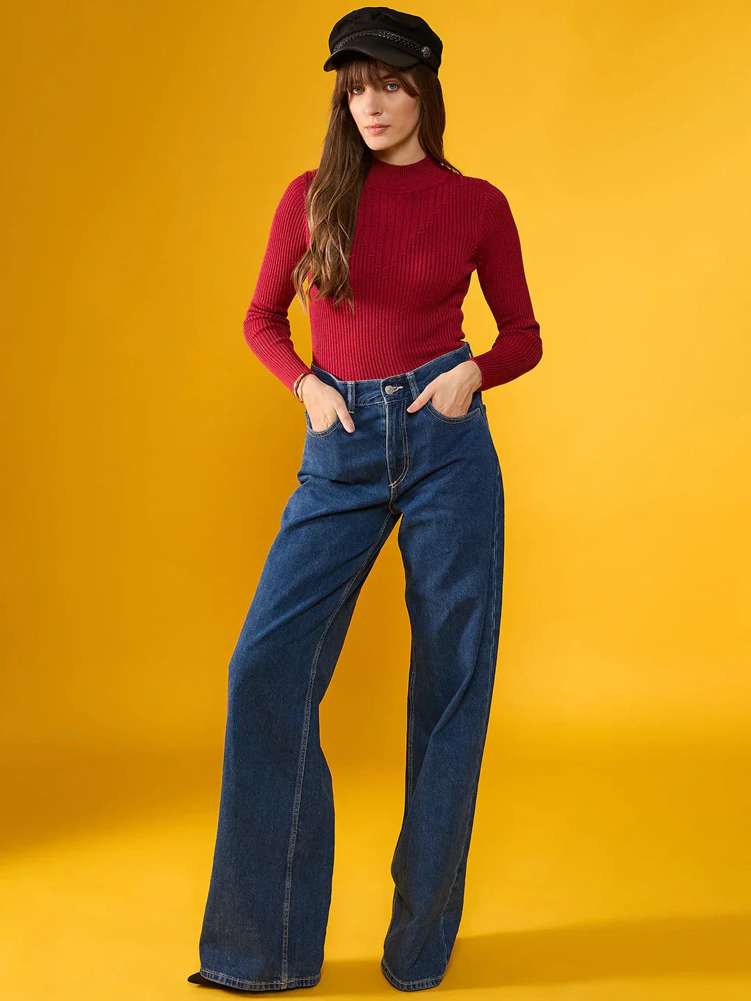 Woman in a 98degreenorth Maroon Ribbed Turtle Neck Slim Fit Sweater poses against a bright yellow background.