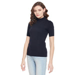 Woman in a 98degreenorth navy blue ribbed half sleeve slim fit turtle neck sweater, standing against a white background.