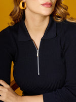 Woman in 98degreenorth Women's Navy Ribbed Collar Zipper Sweater, classic slim fit, against a yellow background.