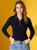 Woman wears 98degreenorth Navy Ribbed Collar Zipper Sweater—slim fit knitwear—standing with hands in pockets.