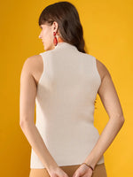 Woman wears 98degreenorth Off-White Ribbed High Neck Slim Fit Knit Tank, standing against a yellow background.