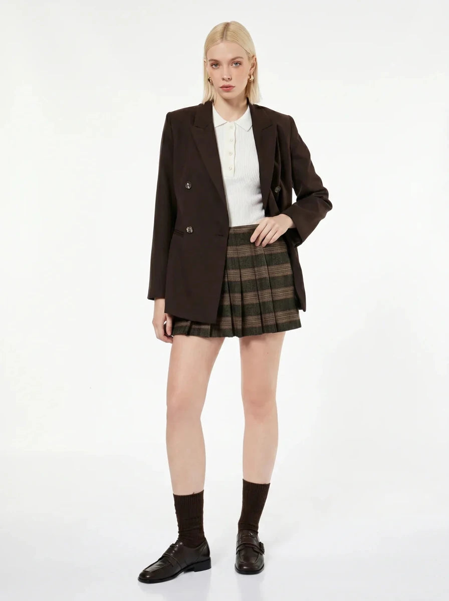 Woman wears 98degreenorth Off-White Ribbed Knit Polo Top with a brown blazer, plaid skirt, socks, and loafers.