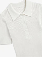 Women's Off-White Ribbed Knit Polo Top by 98degreenorth with buttoned collar, short sleeves, on white background.