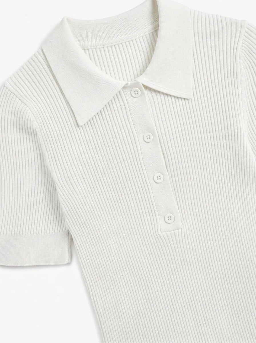Women's Off-White Ribbed Knit Polo Top by 98degreenorth with buttoned collar, short sleeves, on white background.