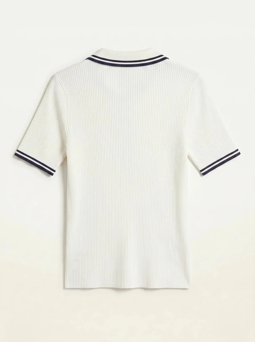 Women's off-white ribbed polo top with navy tipped collar by 98degreenorth, shown from the back.