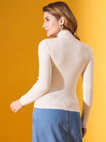 Woman wears 98degreenorth Off White Ribbed Turtle Neck Slim Fit Sweater, paired with a blue skirt, against yellow.