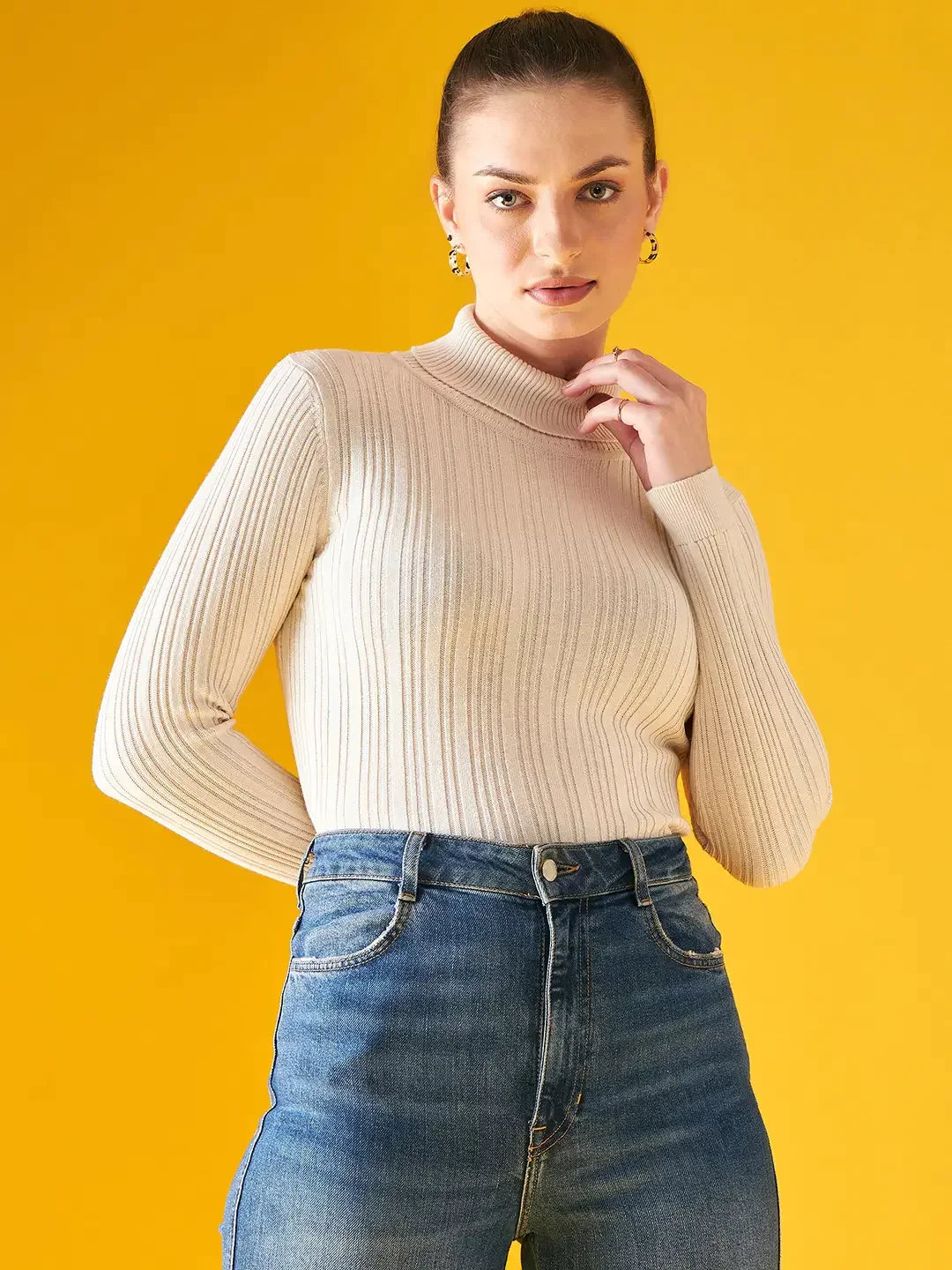 Woman in 98degreenorth Off-White Ribbed Turtleneck Slim Fit Sweater, elegant winter wear for Indian women.