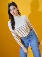 Woman wears 98degreenorth Off-White Ribbed Turtleneck Sweater, posing in jeans with white sunglasses on her head.