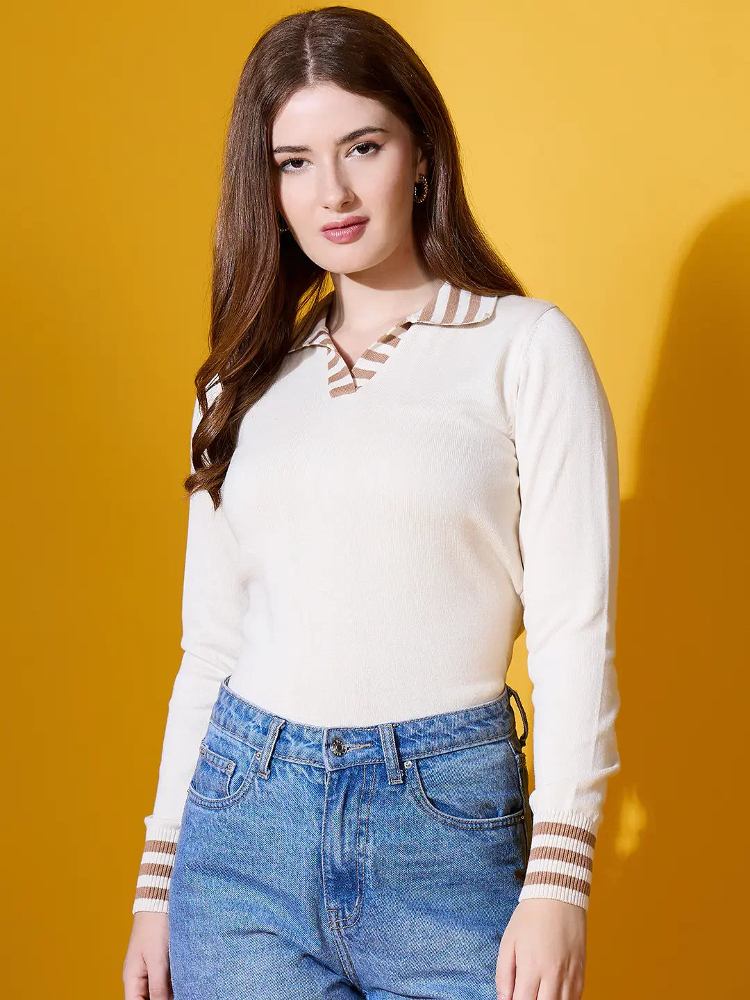 Woman in a 98degreenorth Off-White Striped Collar Knit Sweater, exuding quiet luxury against a yellow background.