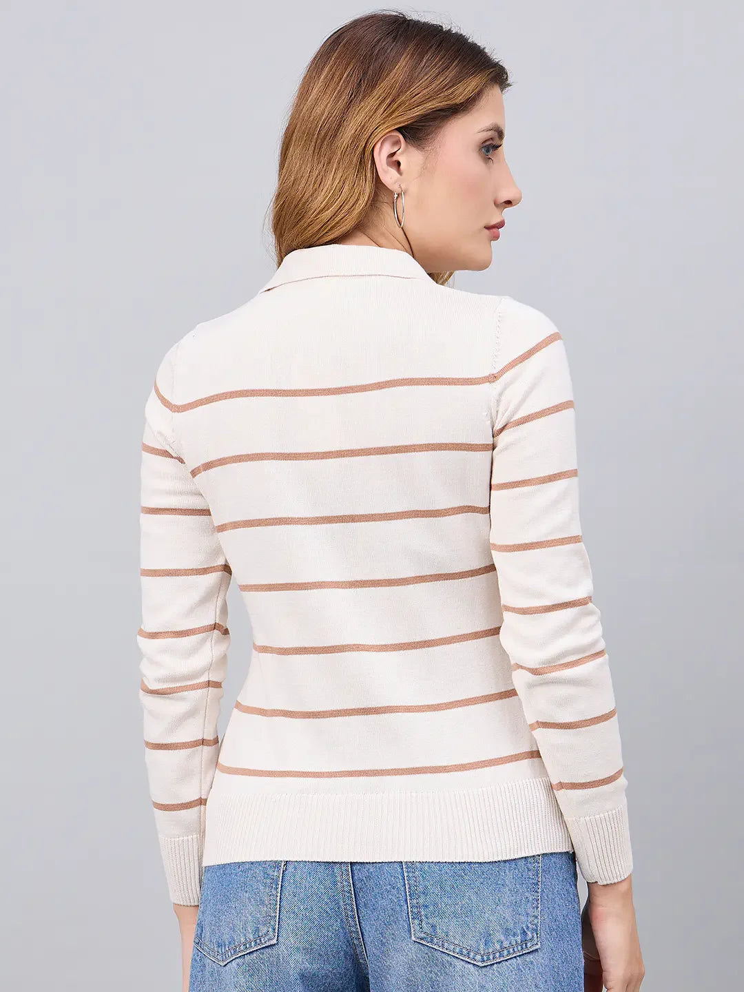 Woman with light brown hair wears a 98degreenorth Off-White Striped Collared Sweater, facing away from the camera.