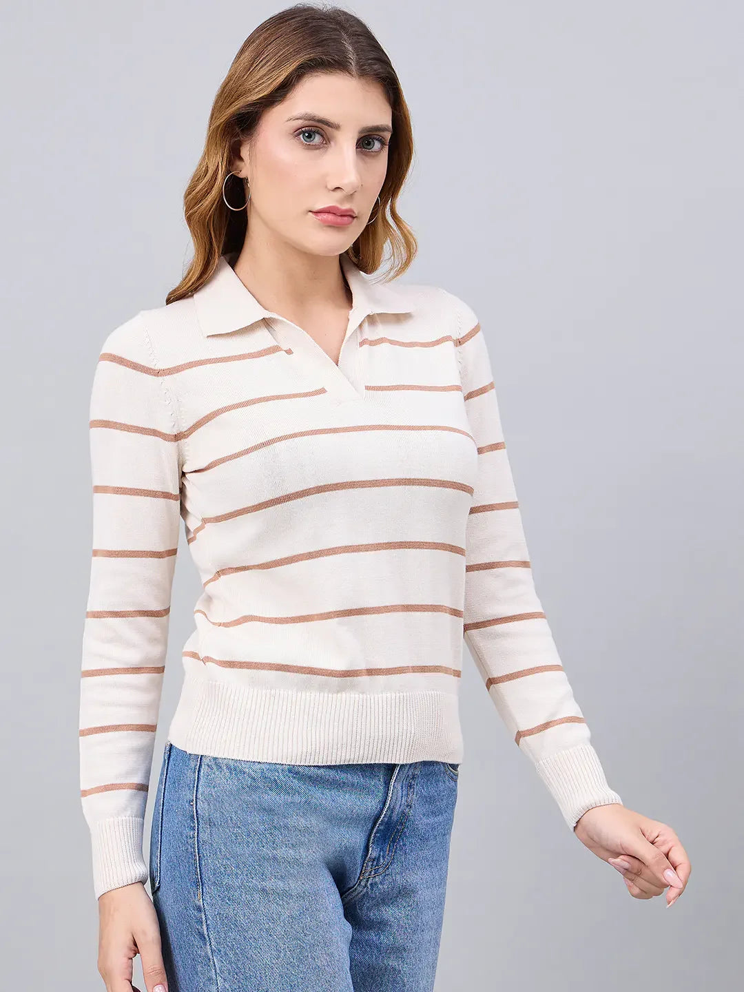 Model wears the 98degreenorth Off-White Striped Collared Sweater with blue jeans against a plain gray background.