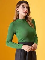 Woman in a 98degreenorth parrot green ribbed high-neck sweater, posing stylishly against a yellow background.