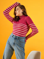 Woman in 98degreenorth’s pink ribbed striped turtleneck sweater and jeans poses against a vibrant yellow background.