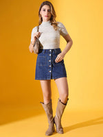 Woman in a 98degreenorth Pista Green Slim Fit Ribbed Turtle Neck Sweater poses against a solid yellow background.