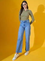 Woman in 98degreenorth’s Pista Melange Ribbed Collar Neck Sweater poses against a yellow background.