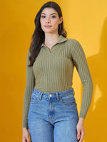 Woman in 98degreenorth Women’s Pista Melange Ribbed Collar Neck Sweater and blue jeans against a yellow background.