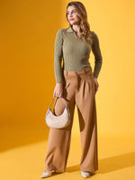 Woman in 98degreenorth Women’s Pista Melange Ribbed Collar Sweater, tan wide-leg pants, holding a beige handbag.