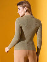 Woman in a 98degreenorth Pista Melange stretchable ribbed collar sweater, facing away on a yellow background.