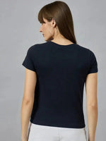 Woman with straight brown hair wears a 98degreenorth pure cotton printed typography t-shirt, facing away.