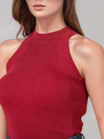Woman in 98degreenorth Women’s Red Ribbed Halter Neck Sleeveless Knit Top, perfect for parties or everyday wear.