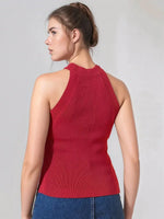 Woman in 98degreenorth Women’s Red Ribbed Halter Neck Sleeveless Knit Top and blue jeans, shown from the back.