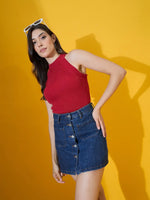 Woman in 98degreenorth Women’s Red Ribbed Halter Neck Tank poses in denim skirt, white sunglasses, yellow background.