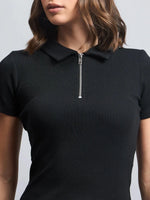 Model wearing 98degreenorth Women's Ribbed Half-Zip Polo Top in black, shoulder-up view.