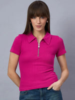 Woman in a 98degreenorth ribbed fuchsia pink half-zip polo crop top and blue jeans, against a gray background.
