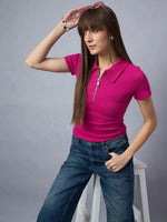 Woman wears 98degreenorth's Women's Ribbed Half-Zip Polo Top in fuchsia pink with jeans, posing on a stool with sunglasses.