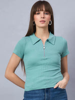 Woman wears 98degreenorth's Women's Ribbed Half-Zip Polo Top in Sea Green, styled with blue jeans.