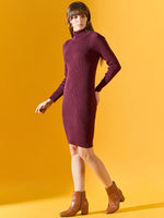 Woman in a 98degreenorth Women’s Ribbed Knitted Bodycon Dress – Burgundy stands against a yellow background.