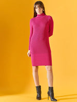 Woman wears 98degreenorth’s fuchsia ribbed bodycon turtleneck dress, standing confidently against a yellow background.